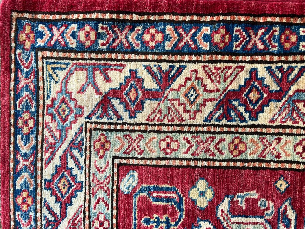 06512 Super Kazak Afghan Red Natural Blue 3-4×4-10 | Manoukian Rugs™ corner