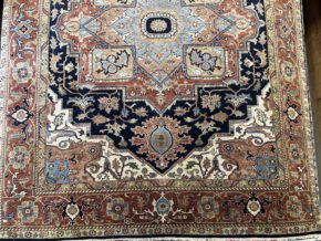 This hand knotted Indo Serapi rug lends a traditional feel to your favorite room. It carries a bold geo-floral design elements along with a pleasing balance of blue, natural and red colors.